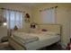 Charming bedroom with a bed, stylish decor, curtains, and abundant natural light at 1211 Phillip St, Winter Springs, FL 32708