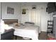 Comfortable bedroom with a bed, wall art, curtains, and ample natural light at 1211 Phillip St, Winter Springs, FL 32708