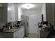 Efficient kitchen featuring white cabinets, granite countertops, and stainless steel appliances at 1211 Phillip St, Winter Springs, FL 32708