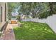 Spacious backyard featuring lush green grass and a privacy fence, perfect for outdoor activities at 12643 Lakebrook Dr, Orlando, FL 32828