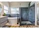 Beautiful bathroom with a glass shower, soaking tub, modern fixtures, and stylish tile design at 12643 Lakebrook Dr, Orlando, FL 32828