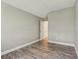 Bedroom with hardwood flooring and neutral walls, showcasing a bright and airy space at 12643 Lakebrook Dr, Orlando, FL 32828