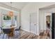 Cozy dining area with a round table and access to other areas of the home at 12643 Lakebrook Dr, Orlando, FL 32828