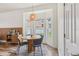 Bright dining area featuring a round table, bay window, and a modern light fixture at 12643 Lakebrook Dr, Orlando, FL 32828