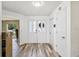 Bright foyer with wood-look floors and double entry doors at 12643 Lakebrook Dr, Orlando, FL 32828