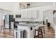 Bright kitchen with granite countertops, stainless steel appliances, and wood floors at 12643 Lakebrook Dr, Orlando, FL 32828