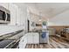 Bright kitchen featuring white cabinets, granite countertops, and stainless steel appliances at 12643 Lakebrook Dr, Orlando, FL 32828