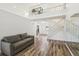 Bright living room featuring wood floors, a vaulted ceiling, a loft, and a staircase at 12643 Lakebrook Dr, Orlando, FL 32828