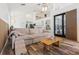 Open-concept living area with wood floors, a large sofa, and natural light at 12643 Lakebrook Dr, Orlando, FL 32828