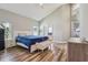 Spacious main bedroom with vaulted ceilings, wood floors, and ensuite bathroom at 12643 Lakebrook Dr, Orlando, FL 32828
