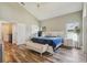 Spacious main bedroom with vaulted ceilings, wood floors, and ensuite bathroom at 12643 Lakebrook Dr, Orlando, FL 32828