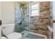 Contemporary shower with glass doors, stylish tile, and a shower head at 12643 Lakebrook Dr, Orlando, FL 32828