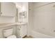 Bathroom featuring a shower-tub combo, and a vanity with lighting and a mirror at 1275 Lake Shadow Cir # 13106, Maitland, FL 32751
