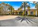 Clubhouse exterior featuring manicured landscaping, large windows, and tile roofing at 1275 Lake Shadow Cir # 13106, Maitland, FL 32751