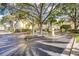 Community entrance with lush landscaping, mature trees, and gate at 1275 Lake Shadow Cir # 13106, Maitland, FL 32751