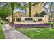 Welcoming entrance to the Visconti condominium community with lush landscaping and a decorative fountain at 1275 Lake Shadow Cir # 13106, Maitland, FL 32751