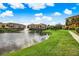 Scenic view of residences surrounding a lake, offering serene waterfront living at 1275 Lake Shadow Cir # 13106, Maitland, FL 32751