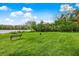 Lush community grounds offer a bench to enjoy the outdoor space at 1275 Lake Shadow Cir # 13106, Maitland, FL 32751