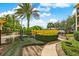 Beautiful landscaping in the community, with palm trees and other mature trees, next to the lake at 1275 Lake Shadow Cir # 13106, Maitland, FL 32751