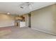 Spacious living room with carpeted floors, ceiling fan, and view of the kitchen area at 1275 Lake Shadow Cir # 13106, Maitland, FL 32751