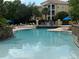 Enjoy the community pool, featuring sparkling water and lounge chairs for relaxation at 1275 Lake Shadow Cir # 13106, Maitland, FL 32751