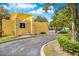 A trash compactor with yellow pillars and covering in the community, with blue skies overhead at 1275 Lake Shadow Cir # 13106, Maitland, FL 32751