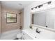 Updated bathroom with tub and shower, vanity, and modern fixtures at 1299 Buccaneer Ave, Deltona, FL 32725