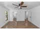 Light filled bedroom featuring modern tile floors and an ensuite bathroom at 1299 Buccaneer Ave, Deltona, FL 32725