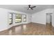 Spacious living room with tile flooring, bay windows, and modern fixtures creating an inviting space at 1299 Buccaneer Ave, Deltona, FL 32725