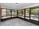 A screened porch that offers natural light and views of the backyard at 1299 Buccaneer Ave, Deltona, FL 32725