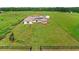 Wide aerial shot of property showcasing the home and expansive lawn at 13023 Sweet Hill Rd, Polk City, FL 33868