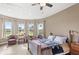 Bright and airy bedroom with scenic views through the large windows, offering a peaceful retreat at 13023 Sweet Hill Rd, Polk City, FL 33868