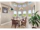 Dining area with large windows offering scenic views of the surrounding landscape at 13023 Sweet Hill Rd, Polk City, FL 33868