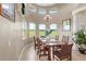 Dining area with large windows offering scenic views of the surrounding landscape at 13023 Sweet Hill Rd, Polk City, FL 33868