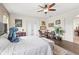 Bright main bedroom with hardwood floors and a cozy reading nook at 13023 Sweet Hill Rd, Polk City, FL 33868