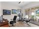 Office space with desk, patio access and view at 13023 Sweet Hill Rd, Polk City, FL 33868