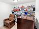 Well-organized storage room with shelves and a comfortable chair at 13023 Sweet Hill Rd, Polk City, FL 33868