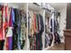 Spacious walk-in closet with custom shelving and rods for organized storage of clothing and accessories at 13023 Sweet Hill Rd, Polk City, FL 33868