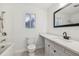 Bathroom featuring tile flooring, bathtub, toilet, sink, vanity and a window at 1320 E Lombardy Dr, Deltona, FL 32725