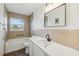 Bathroom featuring tile flooring, bathtub, toilet, sink, vanity and a window at 1320 E Lombardy Dr, Deltona, FL 32725