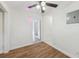 Bedroom featuring hardwood flooring, lighting and window at 1320 E Lombardy Dr, Deltona, FL 32725