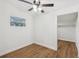 Bright bedroom with hardwood flooring, closet and exterior window at 1320 E Lombardy Dr, Deltona, FL 32725