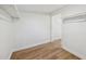 Walk-in closet with lighting, shelving, and access to another walk-in closet at 1320 E Lombardy Dr, Deltona, FL 32725