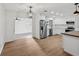 Well-lit kitchen area with stainless steel appliances and open layout to the adjacent living spaces at 1320 E Lombardy Dr, Deltona, FL 32725