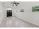 Open-concept living area with tile flooring at 1320 E Lombardy Dr, Deltona, FL 32725
