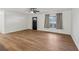 Inviting living room featuring attractive wood-look flooring, a ceiling fan, and a freshly painted interior at 1320 E Lombardy Dr, Deltona, FL 32725