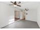 Spacious living room features ceiling fans, and access to other rooms in the home at 1320 E Lombardy Dr, Deltona, FL 32725
