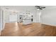 Spacious open floor plan features durable wood-look flooring and seamless access to the kitchen and dining areas at 1320 E Lombardy Dr, Deltona, FL 32725
