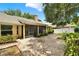 Lovely backyard with a screened-in porch and manicured garden at 1453 Maple Leaf Ln, Deland, FL 32724