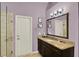 Bathroom with dark cabinets, granite vanity, and glass enclosed shower at 1453 Maple Leaf Ln, Deland, FL 32724